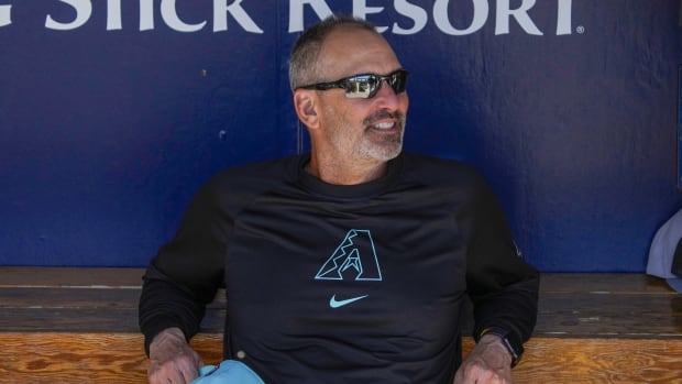 Diamondbacks manager Torey Lovullo (17) sits in the dugout before the game against the Oakland Athletics on March 11, 2024.